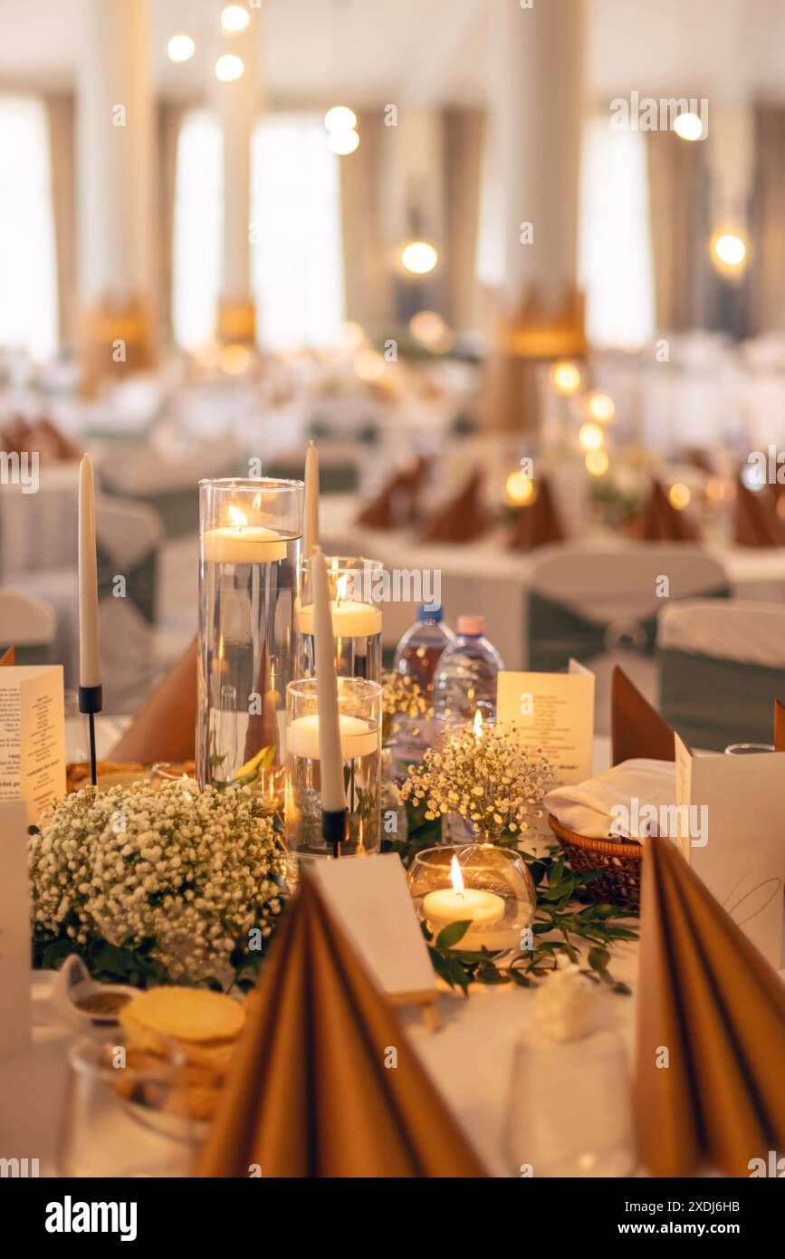 Elegant wedding reception table setting with candlelight Stock Photo