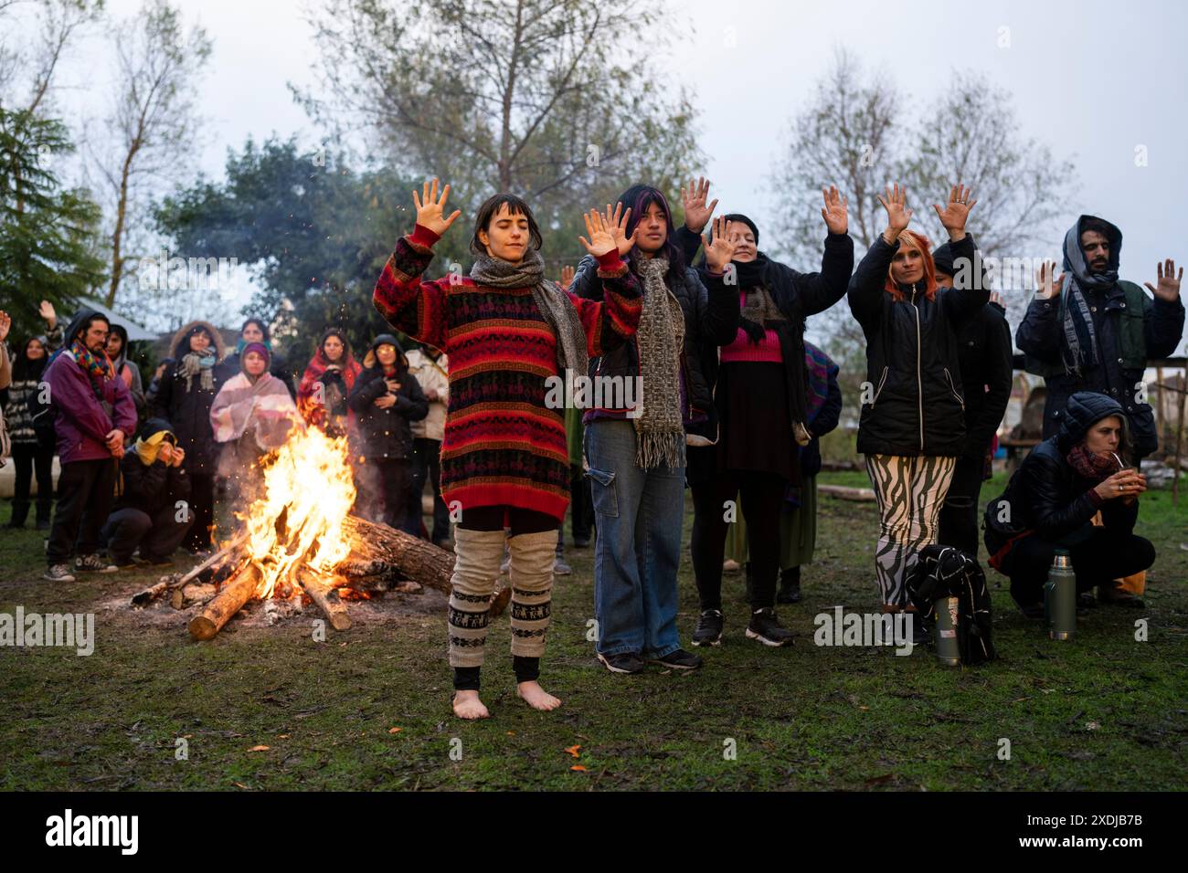 Bonfire Communication Inca People raise their hands toward the sun during a bonfire to celebrate ...