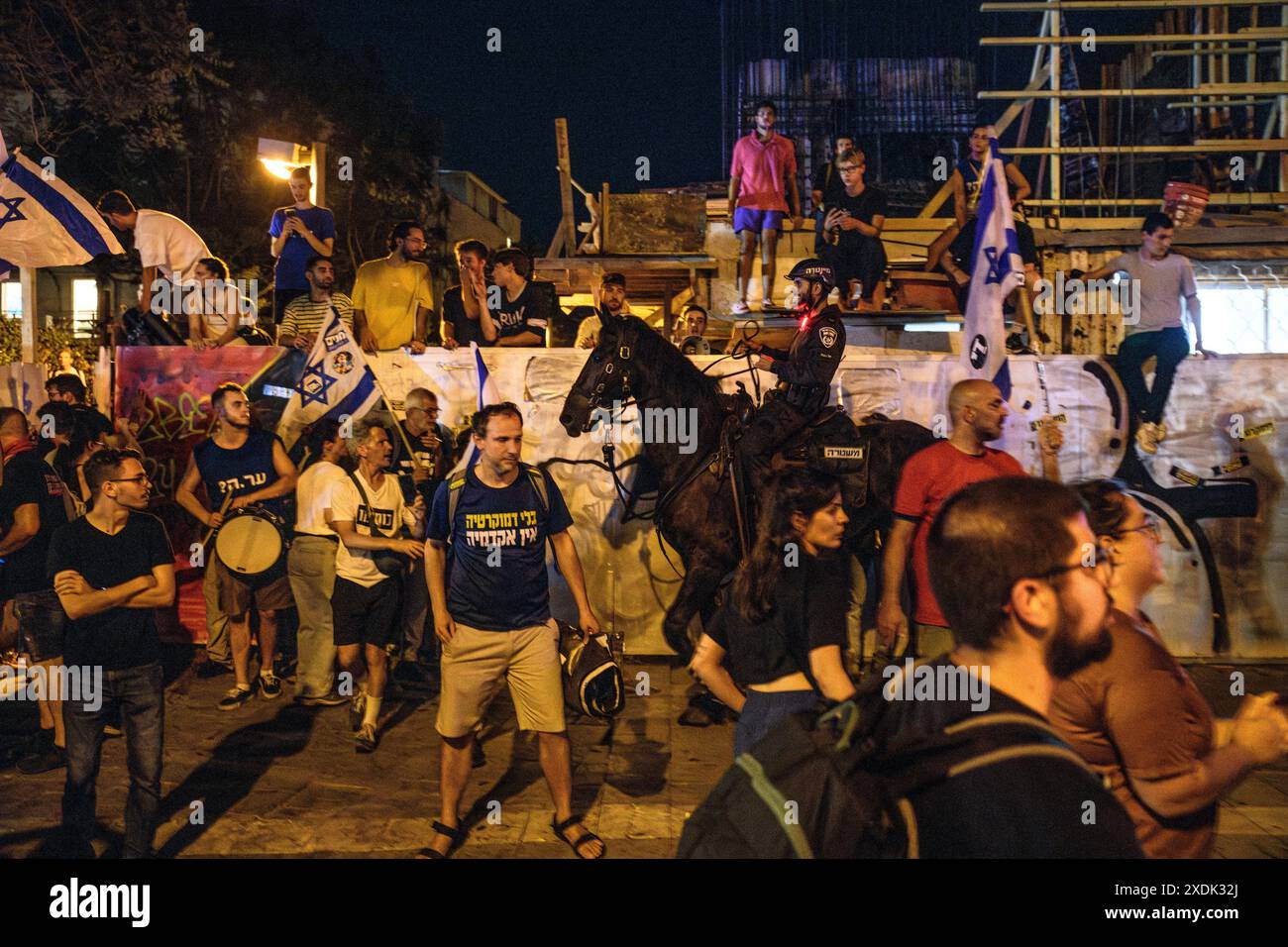 Israel. 22nd June, 2024. Israeli mounted police officers disperse ...