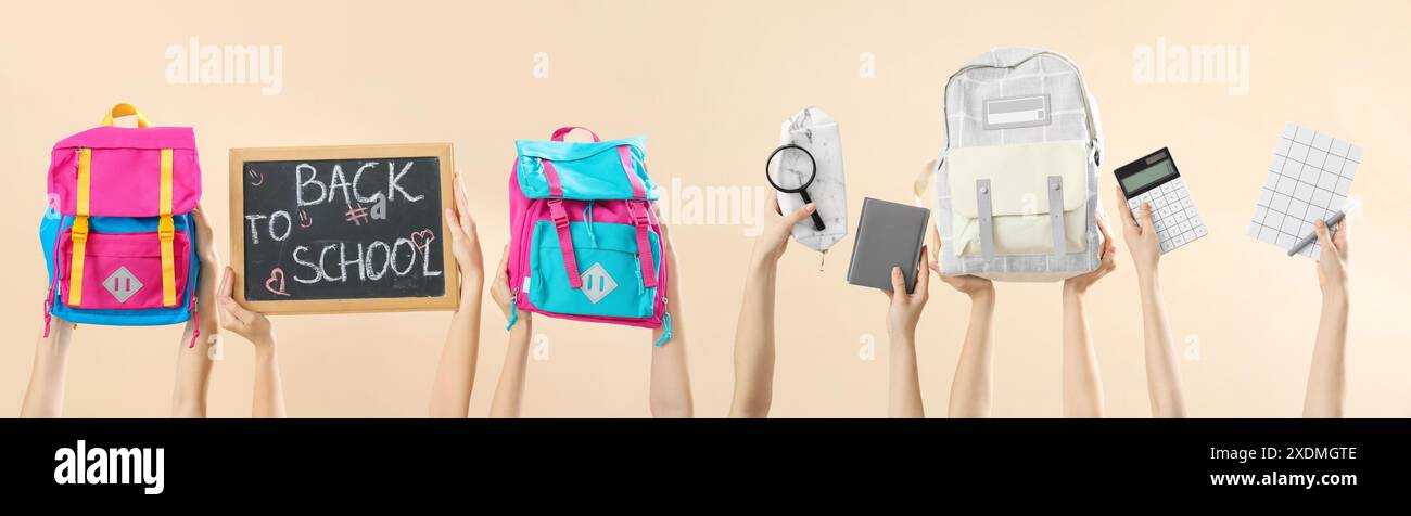 Many hands with school supplies on beige background Stock Photo - Alamy