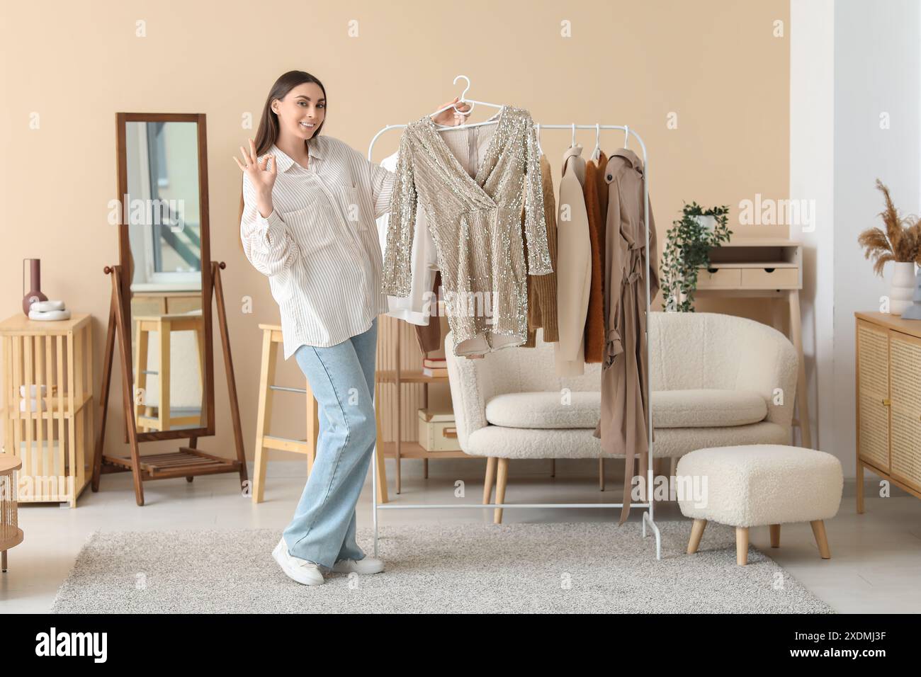 She Has A Rack Woman showing garment rack in hi-res stock photography and images - Alamy