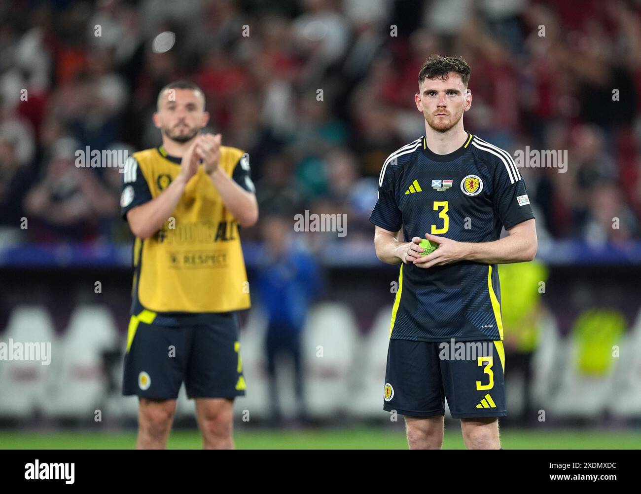 Scotland's John McGinn and Andrew Robertson react after exiting the