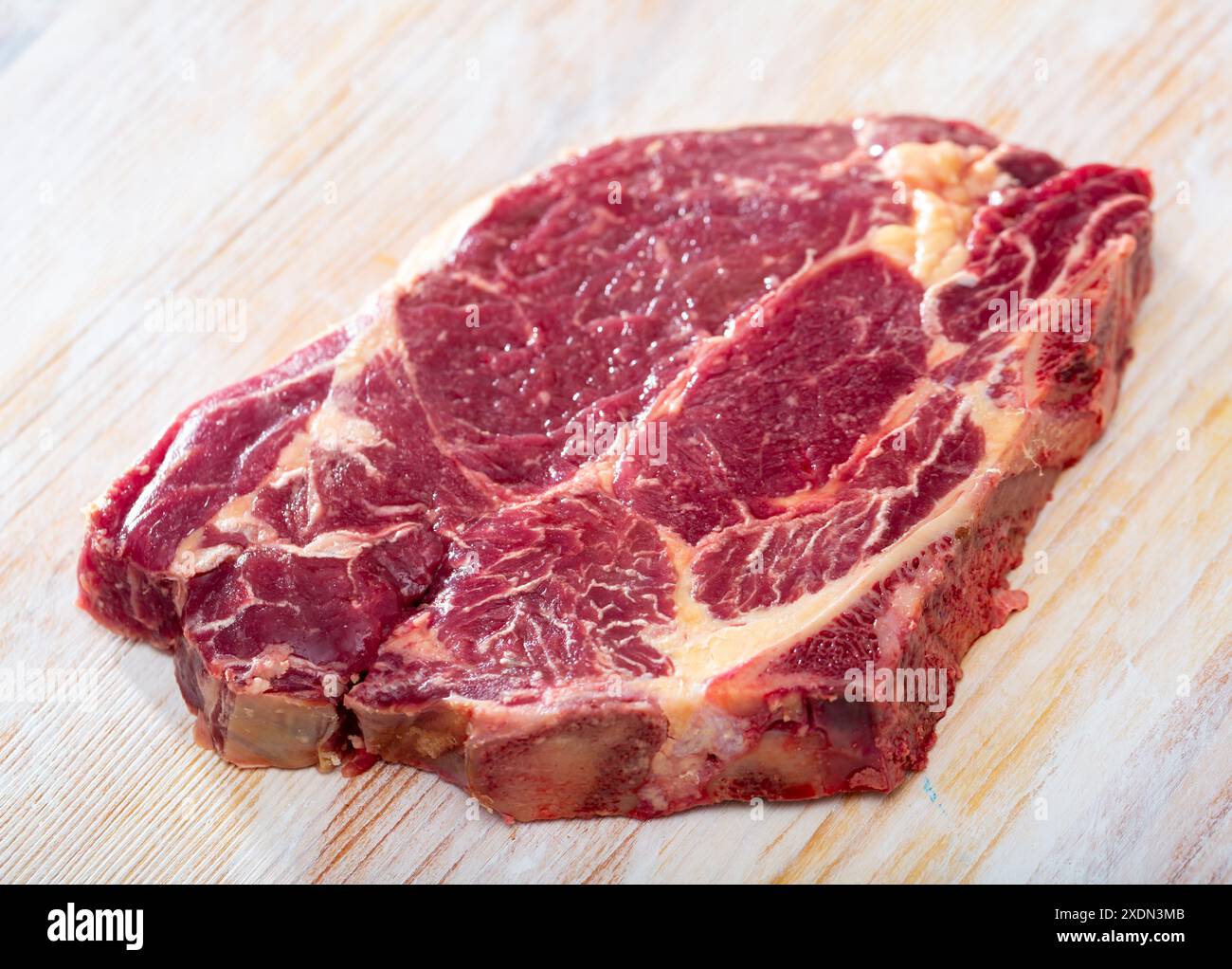Fresh chop of beef on natural wooden background, nobody Stock Photo - Alamy