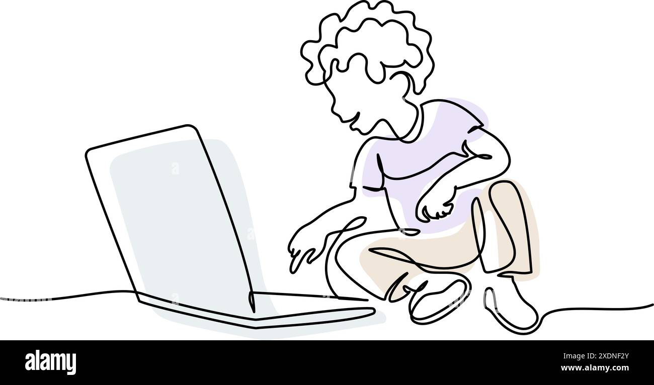 Boy sitting on floor and watching laptop computer. Education concept