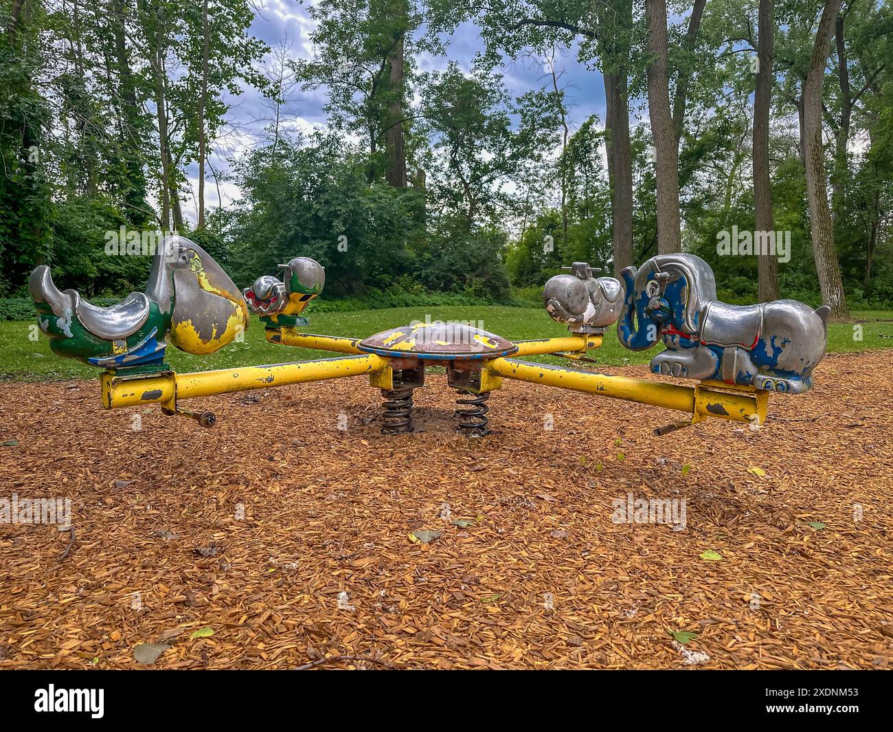 Playground Spring Rocker Chair Playground animal rocking chair hi-res stock photography and images - Alamy