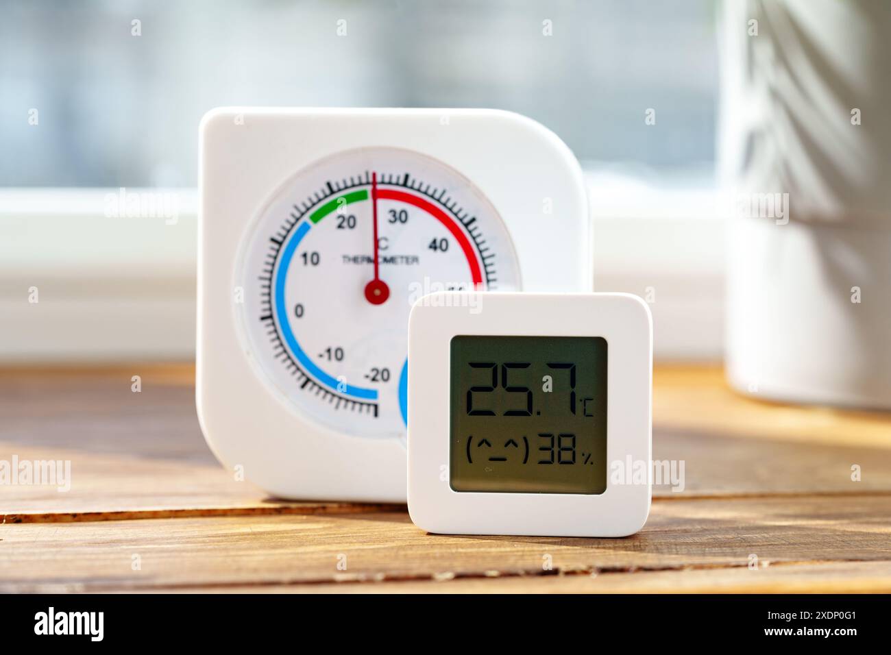 Digital Thermometer Displaying Temperature and Humidity Near Window ...