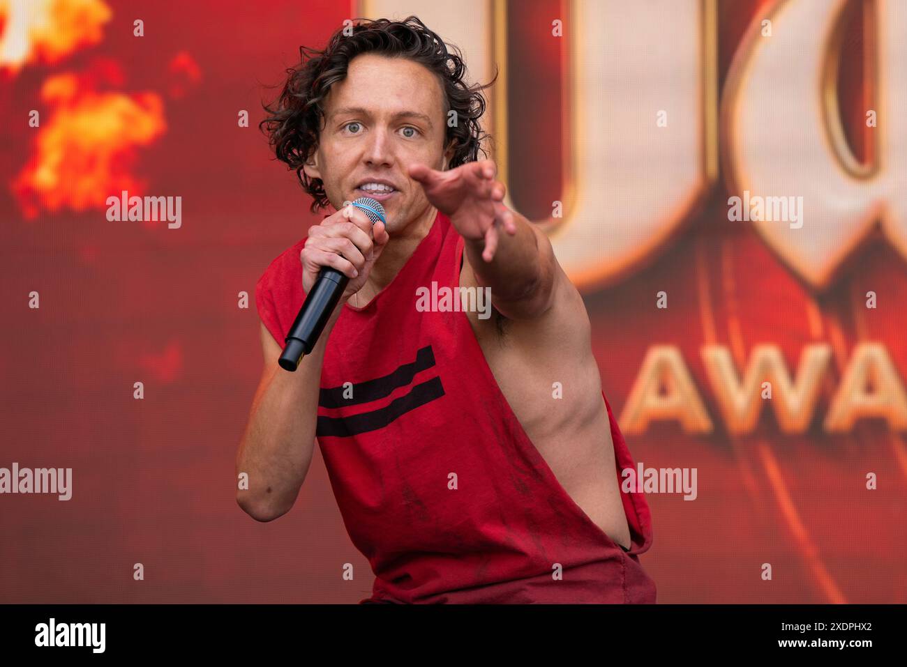 Glenn Adamson performs a song from Musical Bat out of Hell, on stage at West End Live. West End Live at Trafalgar Square on day 2 of the yearly free musical Theatre festival. Thousands of theatre fans pack out Trafalgar Square to watch their favourite performers, actors, musicians and shows on stage.Sundays Line up included Benjamin Button, 43 Balloons, Magic Mike, The Barricade Boys, Why am I so Single?, Mrs Doubtfire, Marie Curie, The Bakers Wife, Hadestown, The Wizard of Oz, Two Strangers ( carry a cake across New York), Standing at the Sky Edge, Closer to Heaven, Bat out of Hell, Heathers, Stock Photo