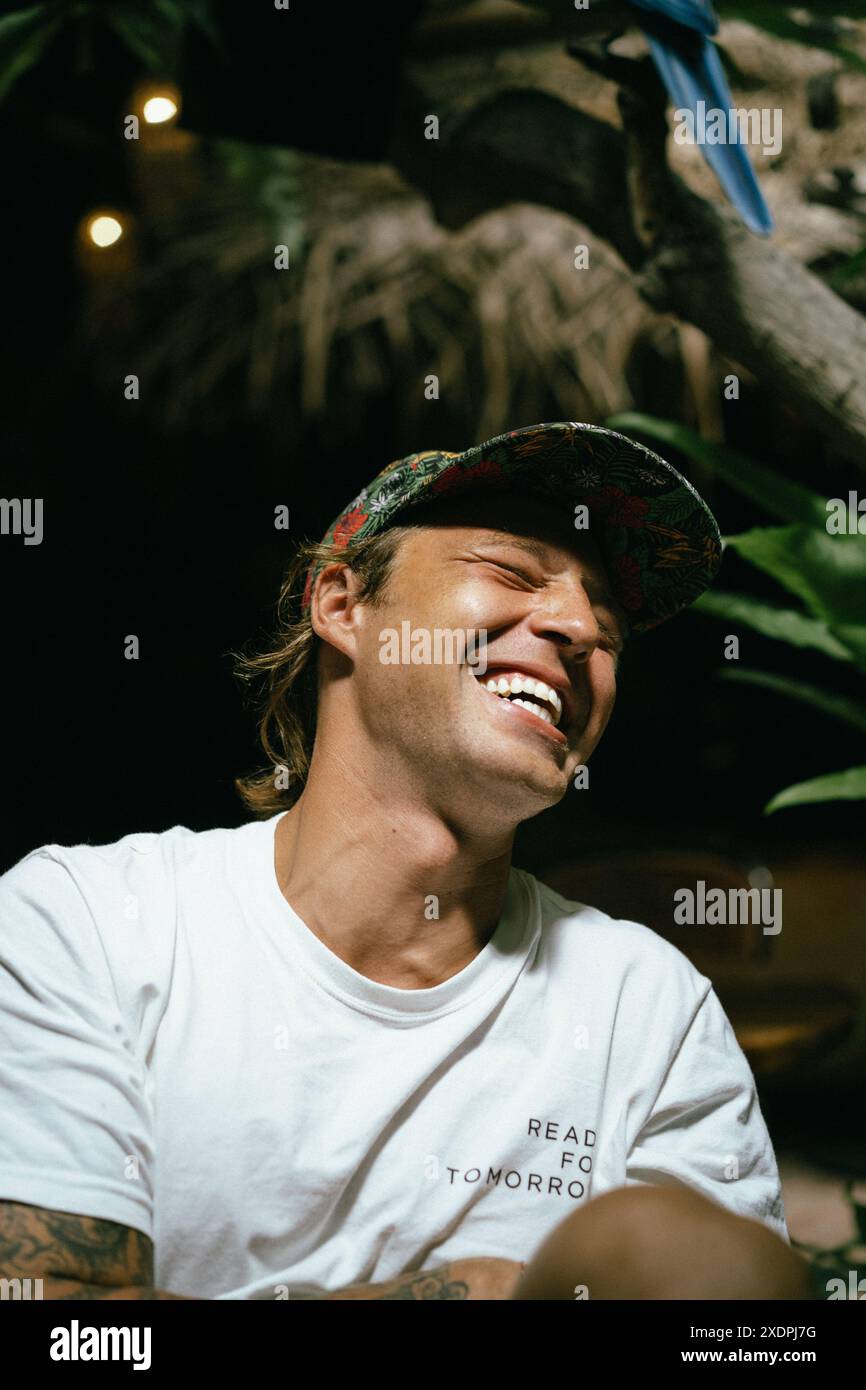 Happy laughing man in a cap. Stock Photo