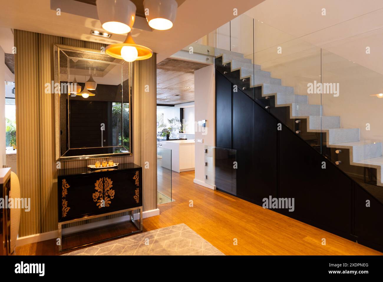 Modern home interior with stylish staircase and elegant furniture in ...
