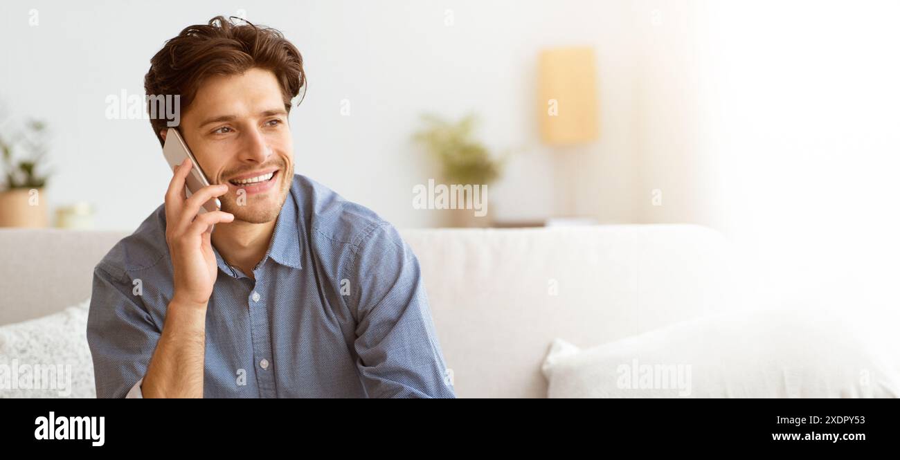 Man Talking on Phone on Couch Stock Photo