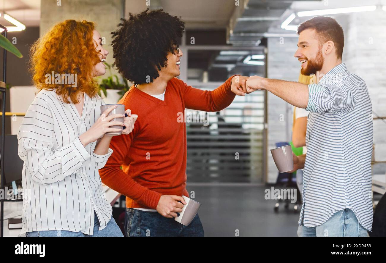 Male friends giving fist hi-res stock photography and images - Alamy