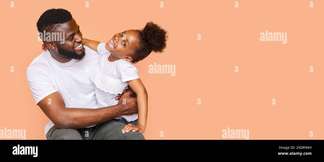 Happy Black Father and Daughter Laughing Together in Studio Stock Photo ...