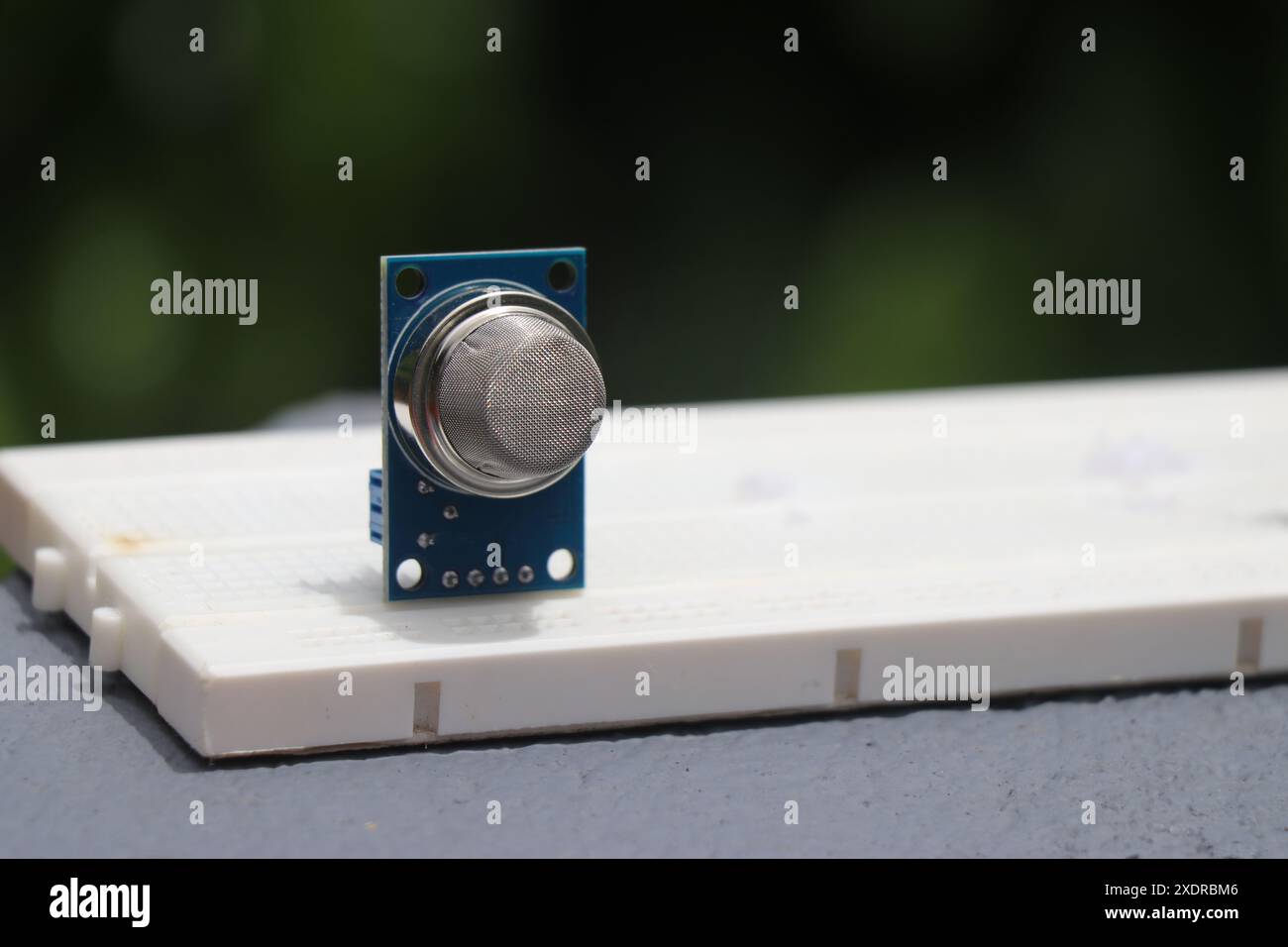 Gas sensor or known by the name MQ2 sensor that can detect the leakage of liquid petroleum gas is placed on a breadboard Stock Photo