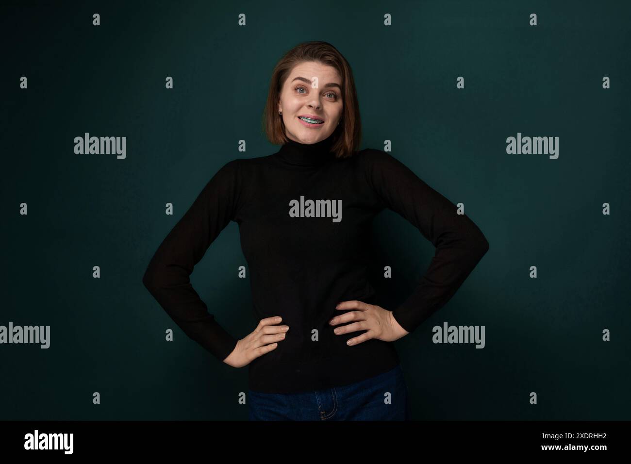 Woman standing proud hands on hips hi-res stock photography and images ...