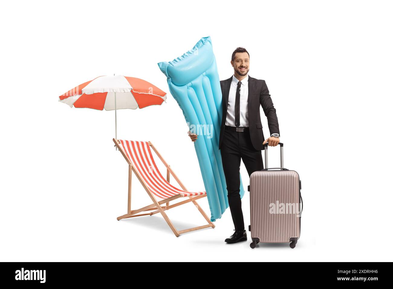 Businessman holding a water floating mattress and a suitcase next to a beach chair isolated on white background Stock Photo