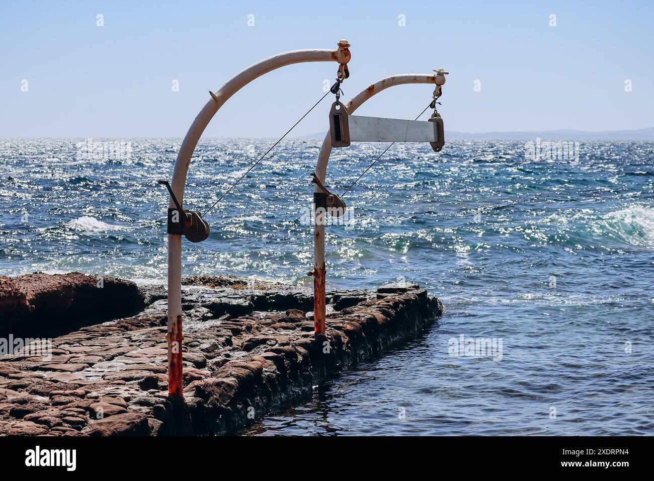 Crane lifting small boat hi-res stock photography and images - Alamy