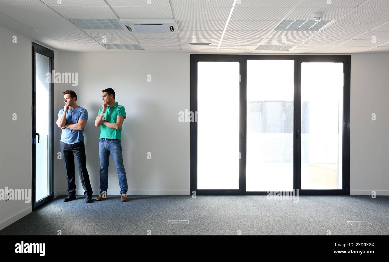 Executives. Empty office building. Stock Photo