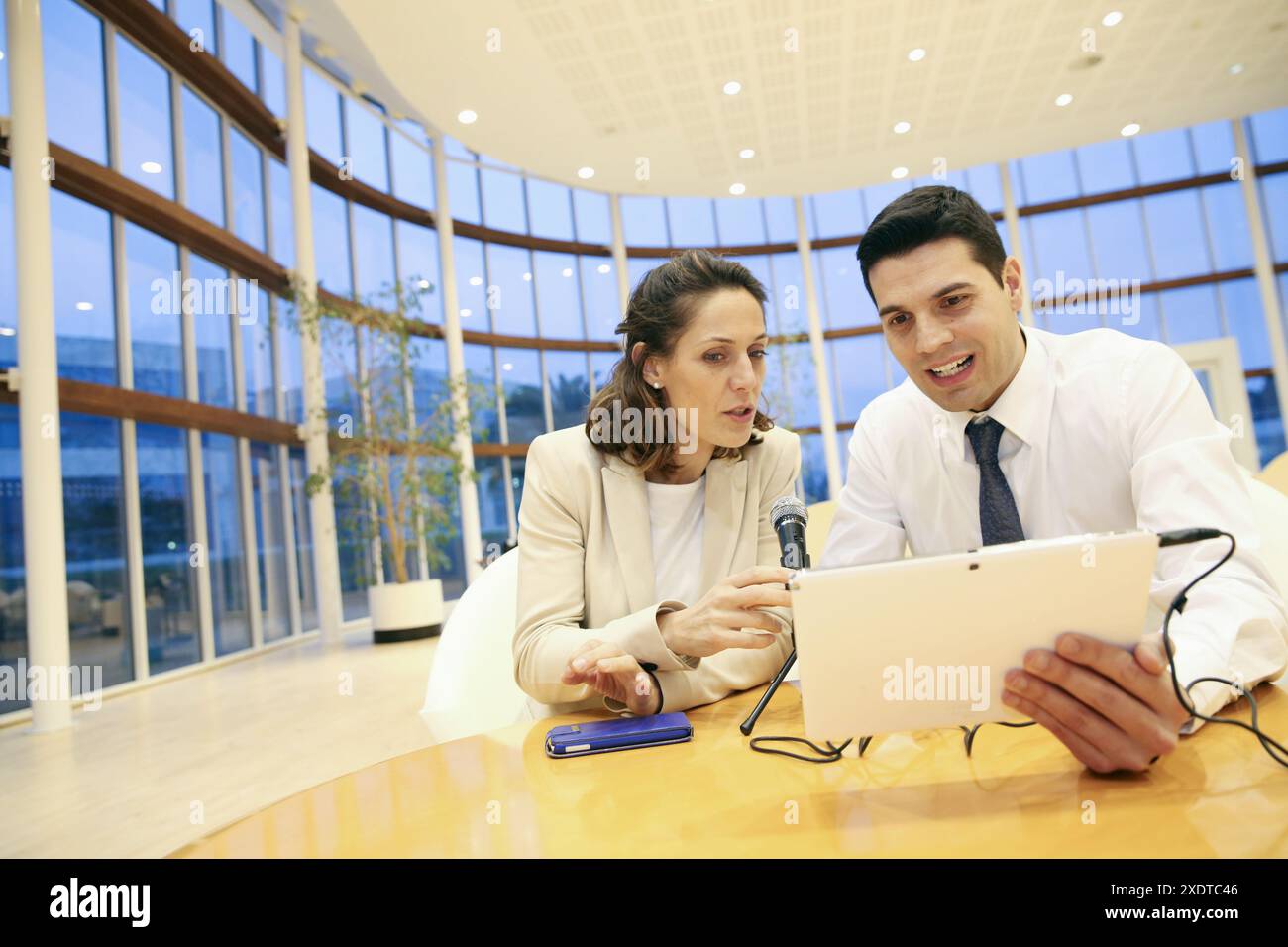 Executives with digital tablet, video conference Stock Photo