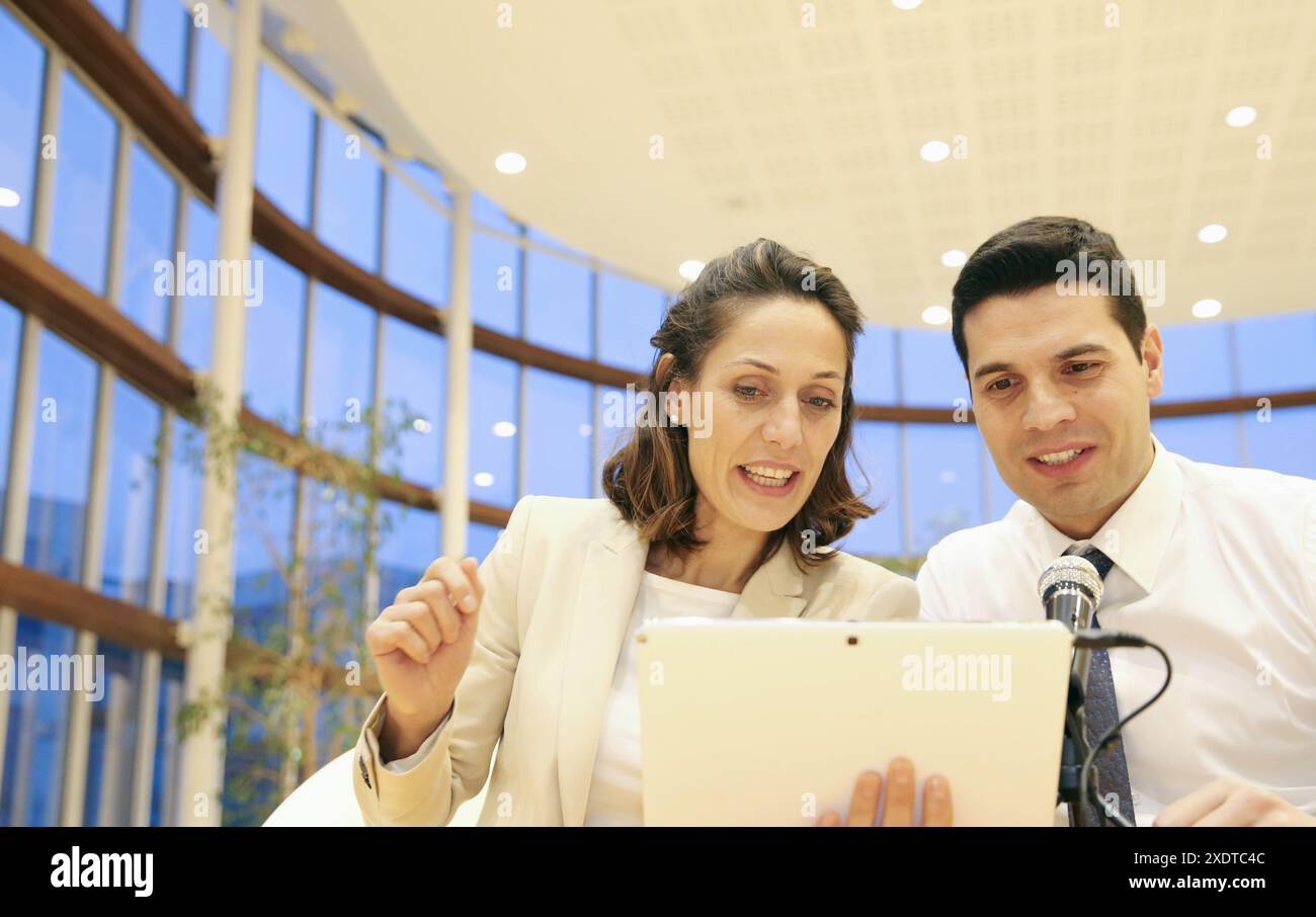 Executives with digital tablet, video conference Stock Photo