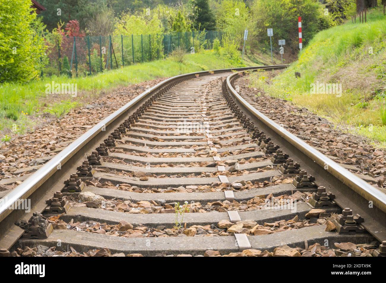 Close up and selective focus photo of railway track or railroad or rel kereta api with morning sunlight. High quality photo Stock Photo