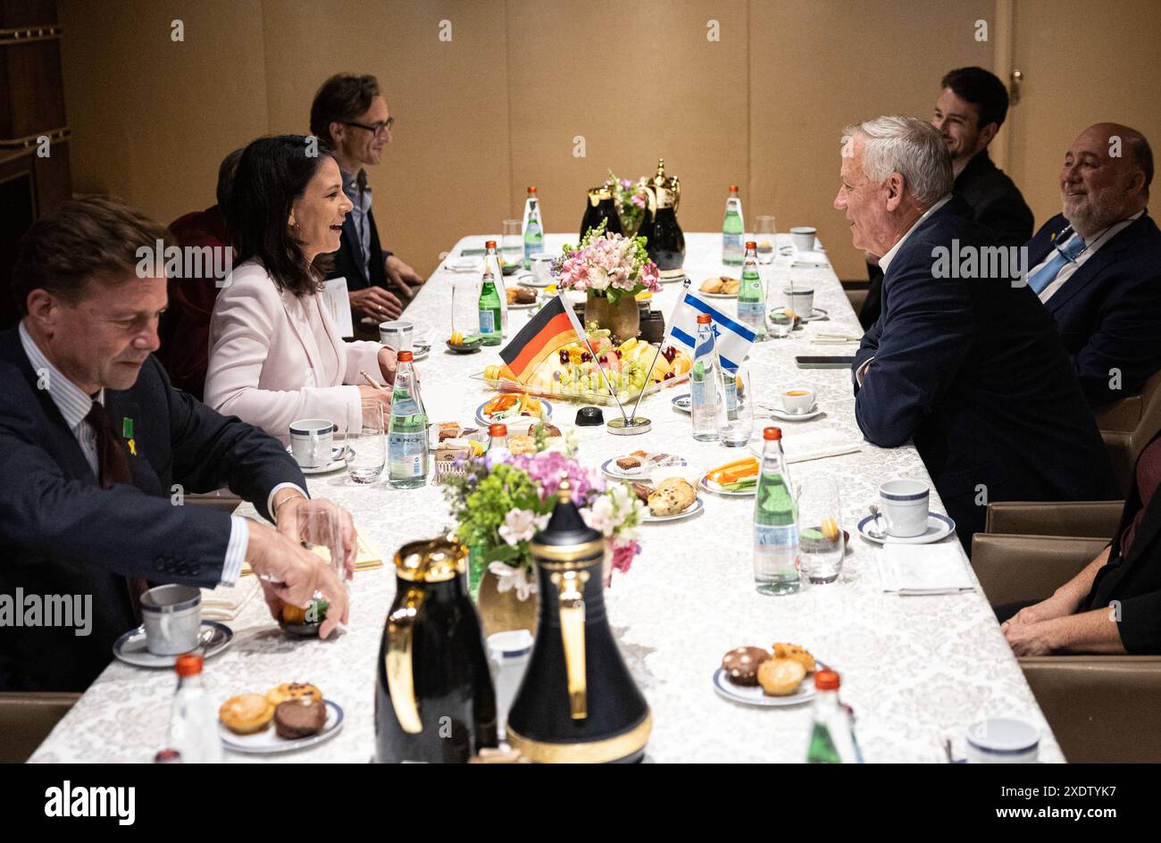 24 June 2024, Israel, Jerusalem: Annalena Baerbock (Alliance 90/The Greens, 2nd from left), Federal Foreign Minister, talks with Benny Gantz (3rd from right), Member of the Israeli Knesset, at the King David Hotel. Ron Prosor (r), Ambassador of Israel to Germany, Steffen Seibert (l), Ambassador of Germany to Israel, and Tobias Tunkel, Regional Representative for the Near and Middle East (3rd from left) also sit at the table. In view of growing concerns about an escalation of the conflict between Israel and the pro-Iranian Hezbollah militia in Lebanon, Baerbock is traveling to Israel for the ei Stock Photo