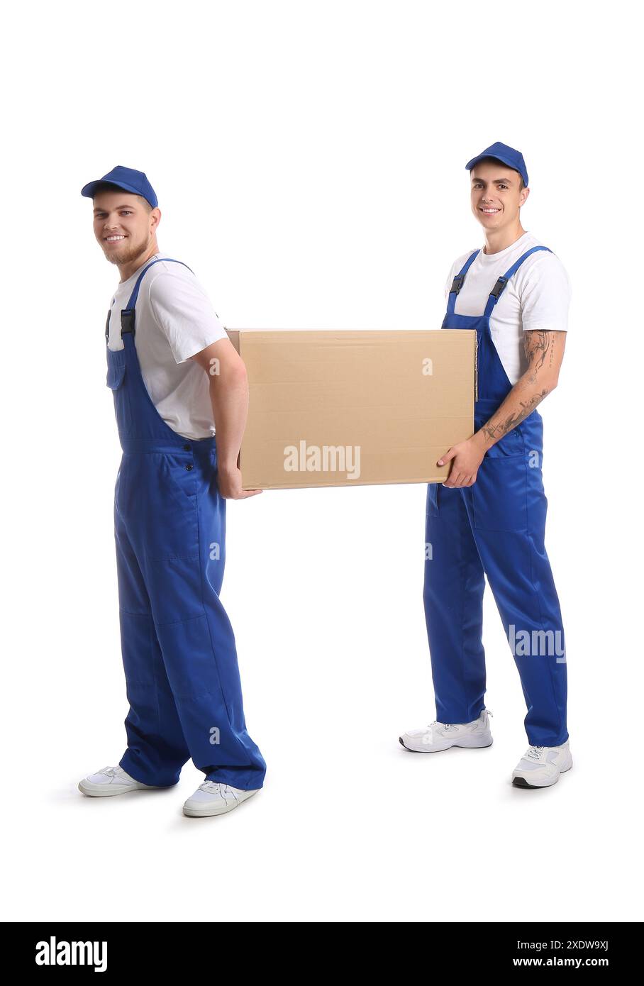 Loaders carrying cardboard box on white background Stock Photo - Alamy