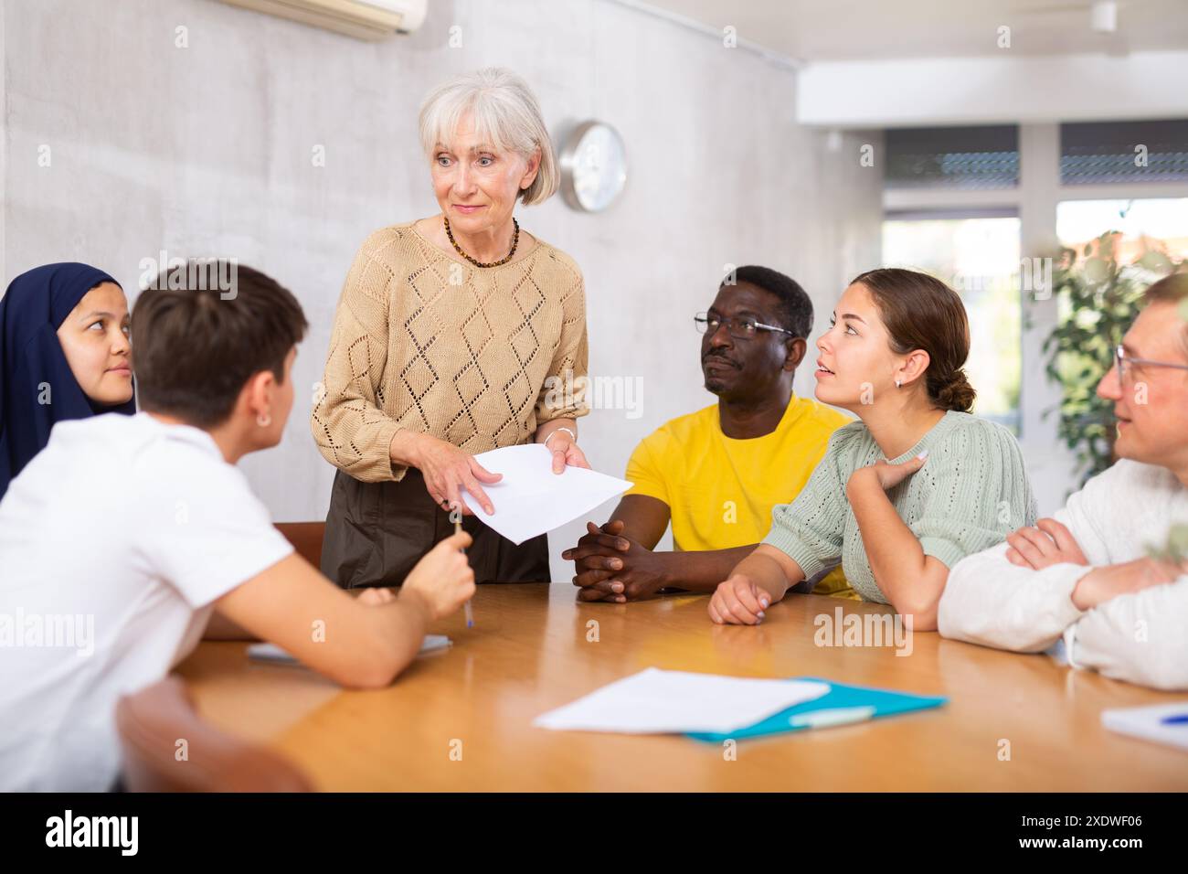 Round table meeting - female manager conducts training for employees of ...