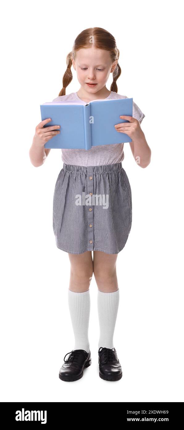 Cute little girl reading book on white background Stock Photo - Alamy