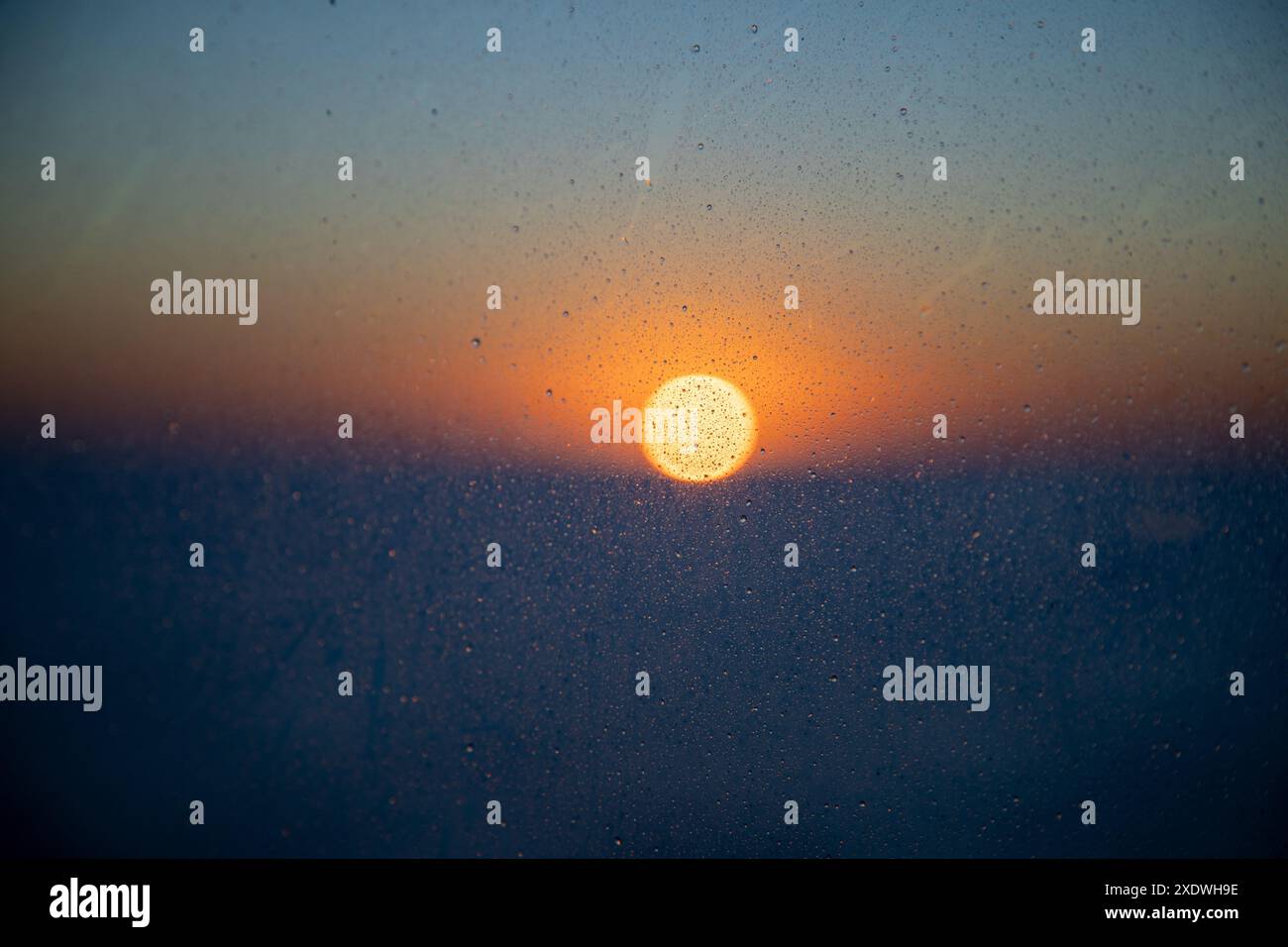 sunset through a raining window, Stock Photo