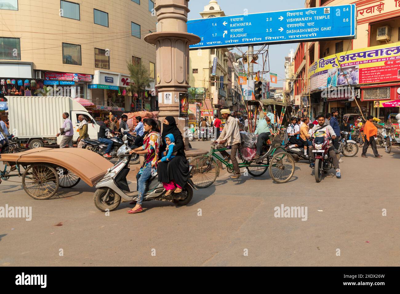 India, Uttar Pradesh, Varanasi, Bangali Tola. Bikes and motorbikes crowd the street. Stock Photo