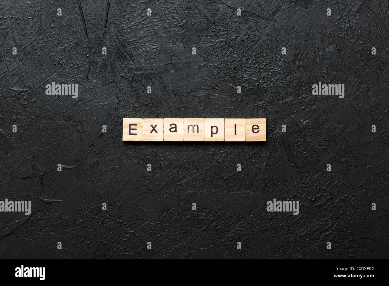 example word written on wood block. example text on table, concept. Stock Photo