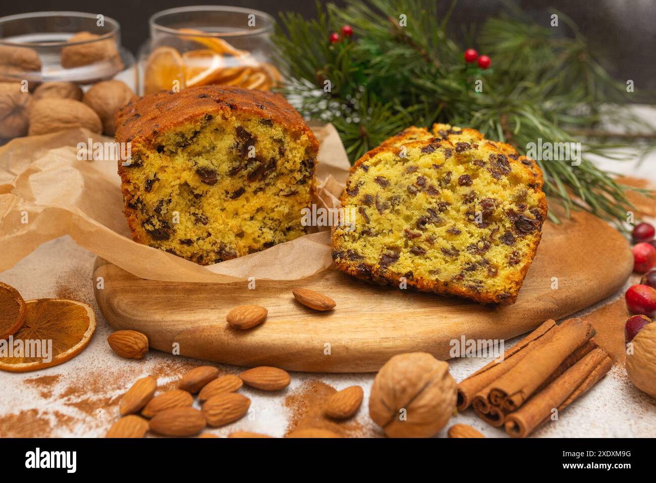 Traditional Christmas cake with raisins and fruits on wooden and white ...