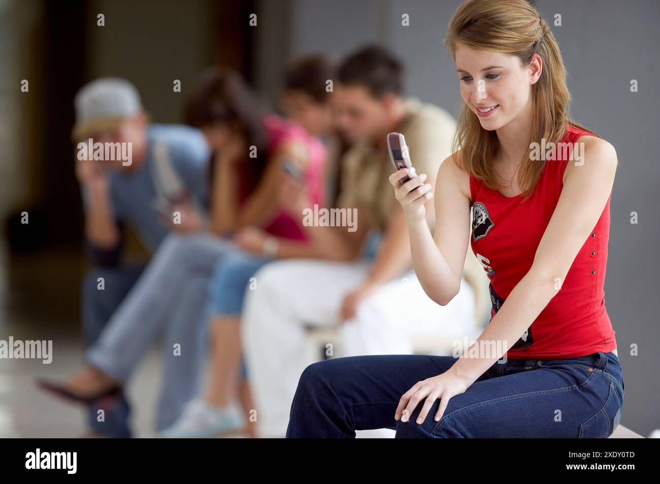 Teen girl sitting knees up hi-res stock photography and images - Alamy