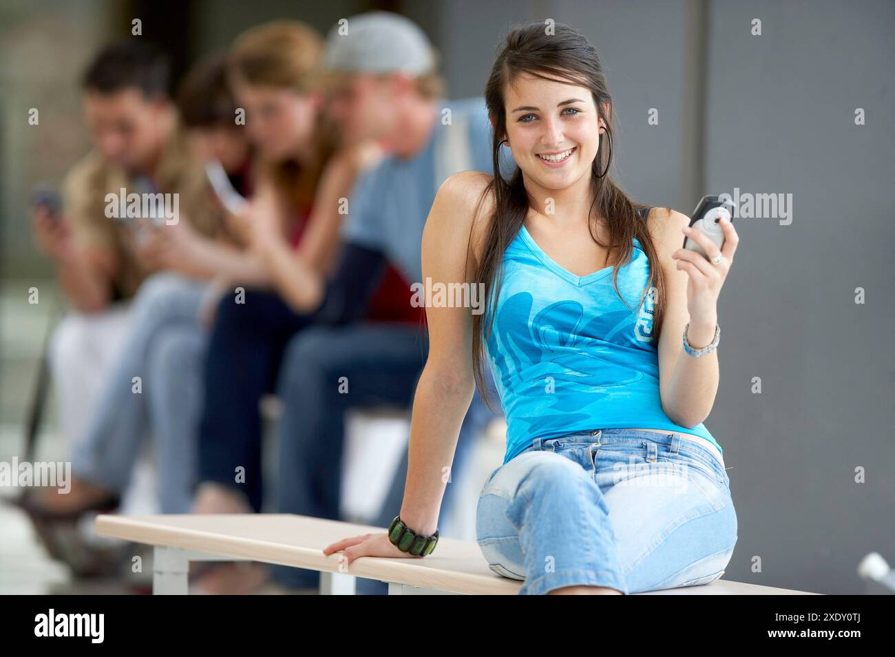 Teen girl sitting knees up hi-res stock photography and images - Alamy