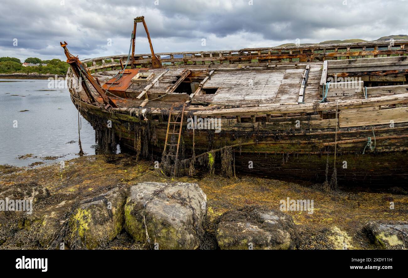 Old shipwrecked wooden fishing boats on the Isle of Mull Stock Photo ...