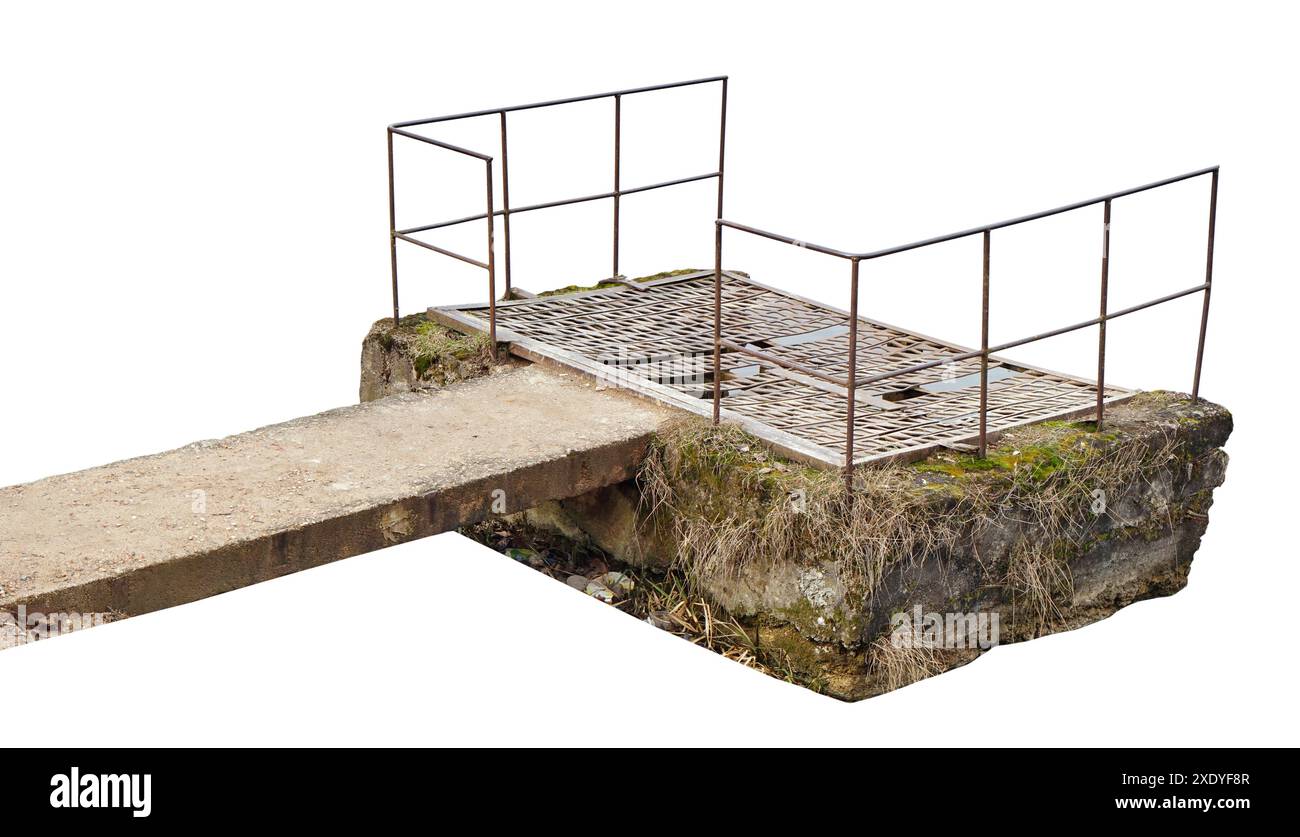 Old vintage concrete well to control the water level in the lake isolated Stock Photo