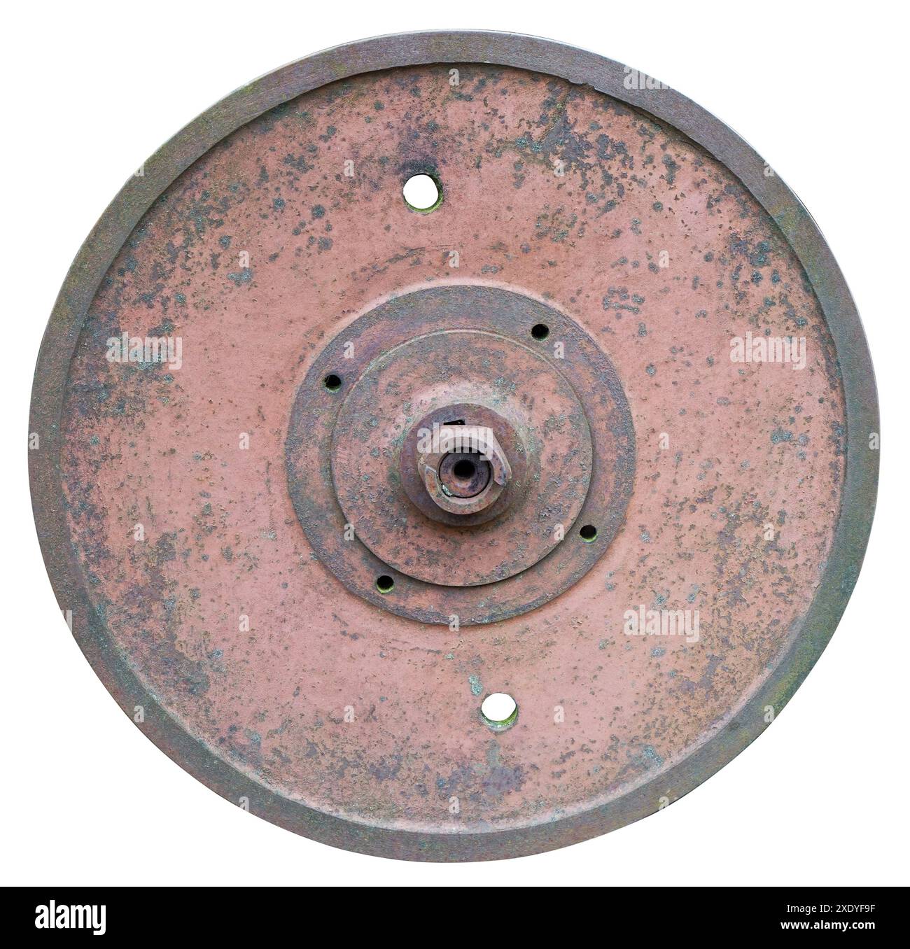 Rusty solid iron red wheel from an retro  agricultural  mill ansd machinery with lichen spots isolated Stock Photo