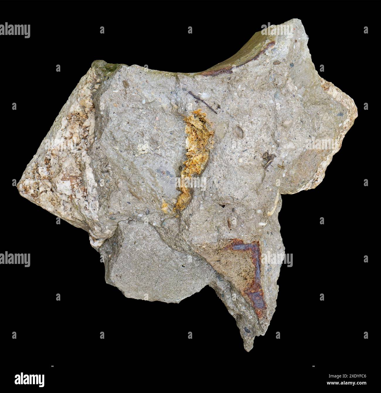 A broken piece of an old concrete wall is similar in shape to a map of the USA isolated black Stock Photo