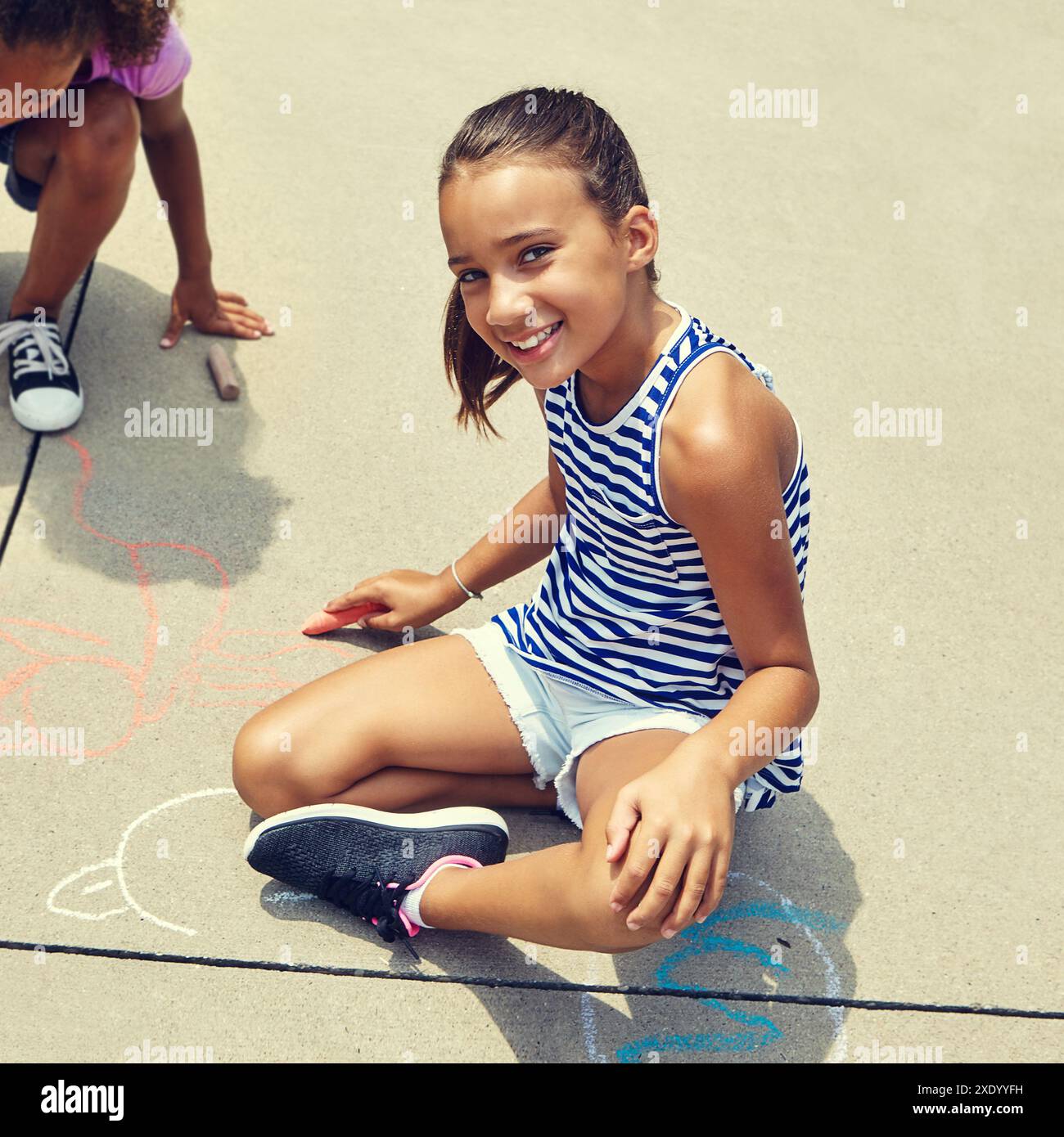 Portrait Playing Girl, children and smile on ground with chalk on concrete for portrait ...