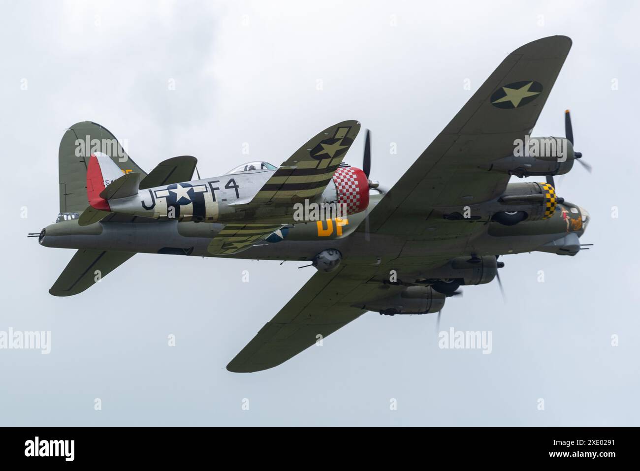 Republic P47 Thunderbolt fighter plane flying alongside Boeing B17