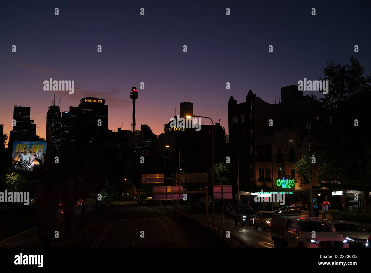 Sydney skyline silhouette against a purple sky at dusk William St from ...
