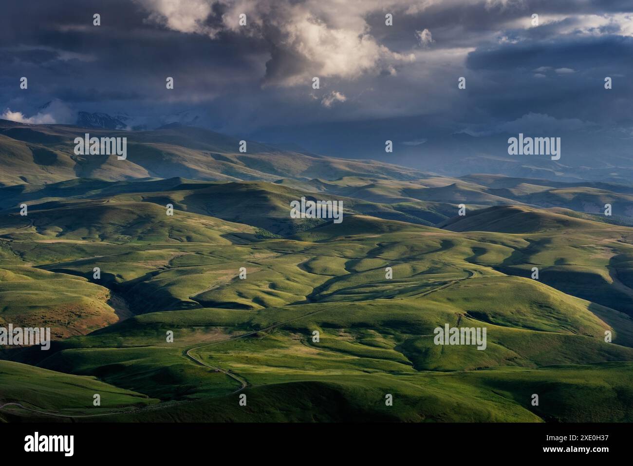 Sunset on hills in Caucasus mountains Stock Photo