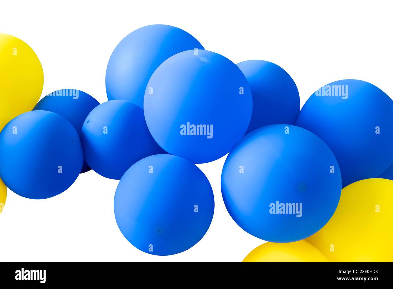 A cluster of yellow and blue balloons isolated on a white background. A bunch of yellow and blue balloons floating in the air, celebration. Stock Photo