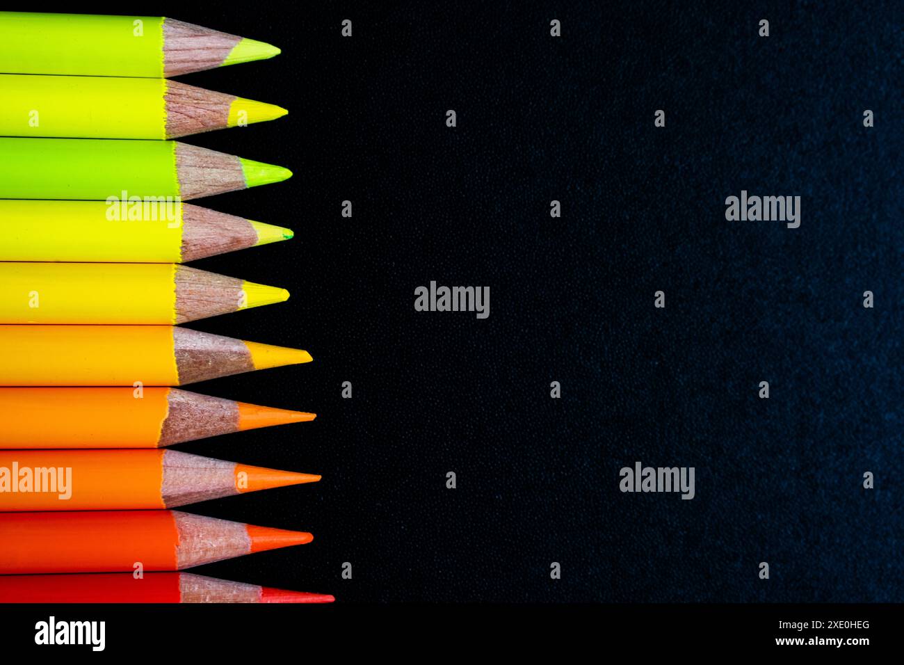 Pencils on black canvas Stock Photo