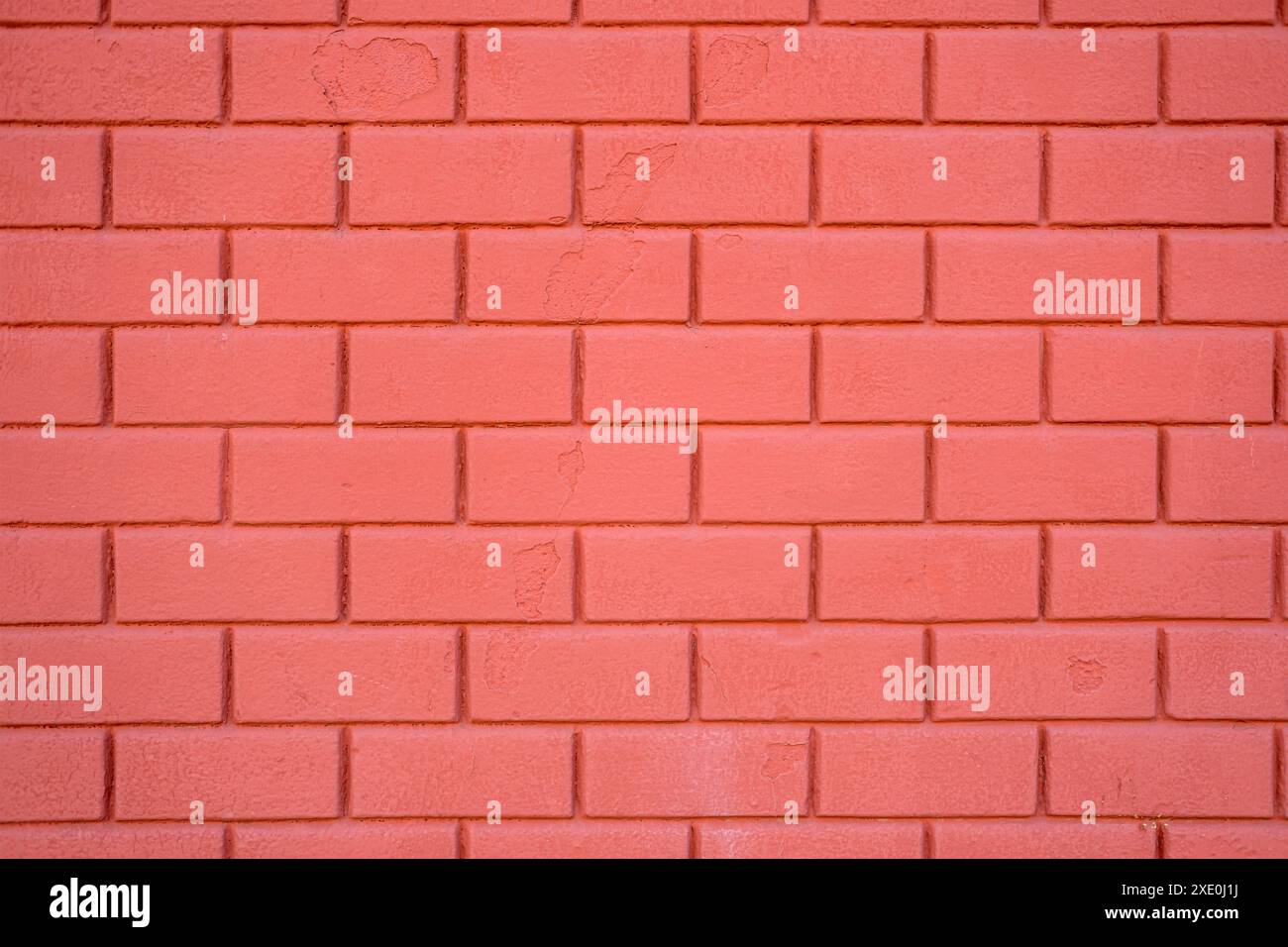 Background from a painted red stone wall Stock Photo