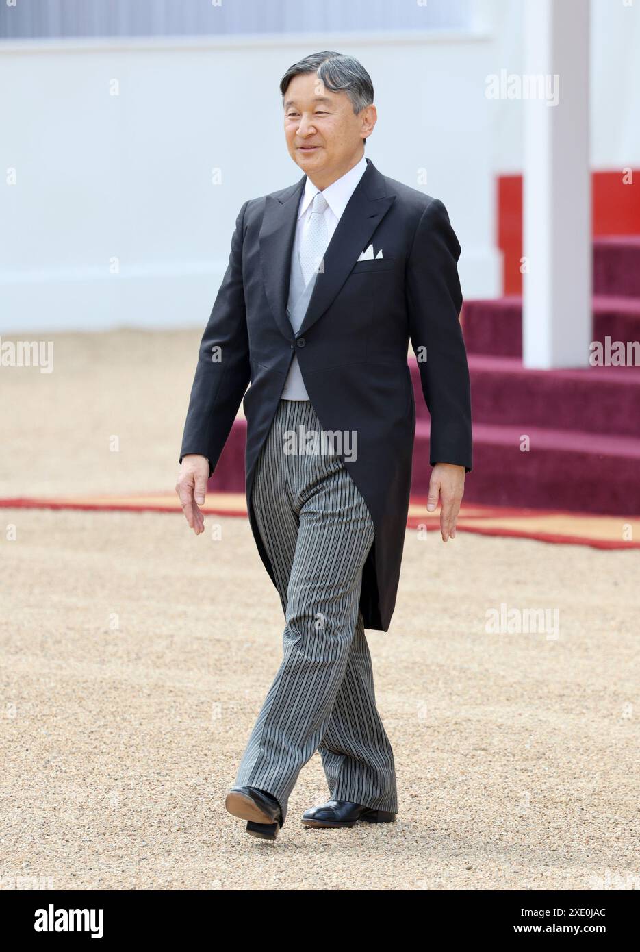 Emperor Naruhito of Japan walks to inspects the guard of honour formed ...