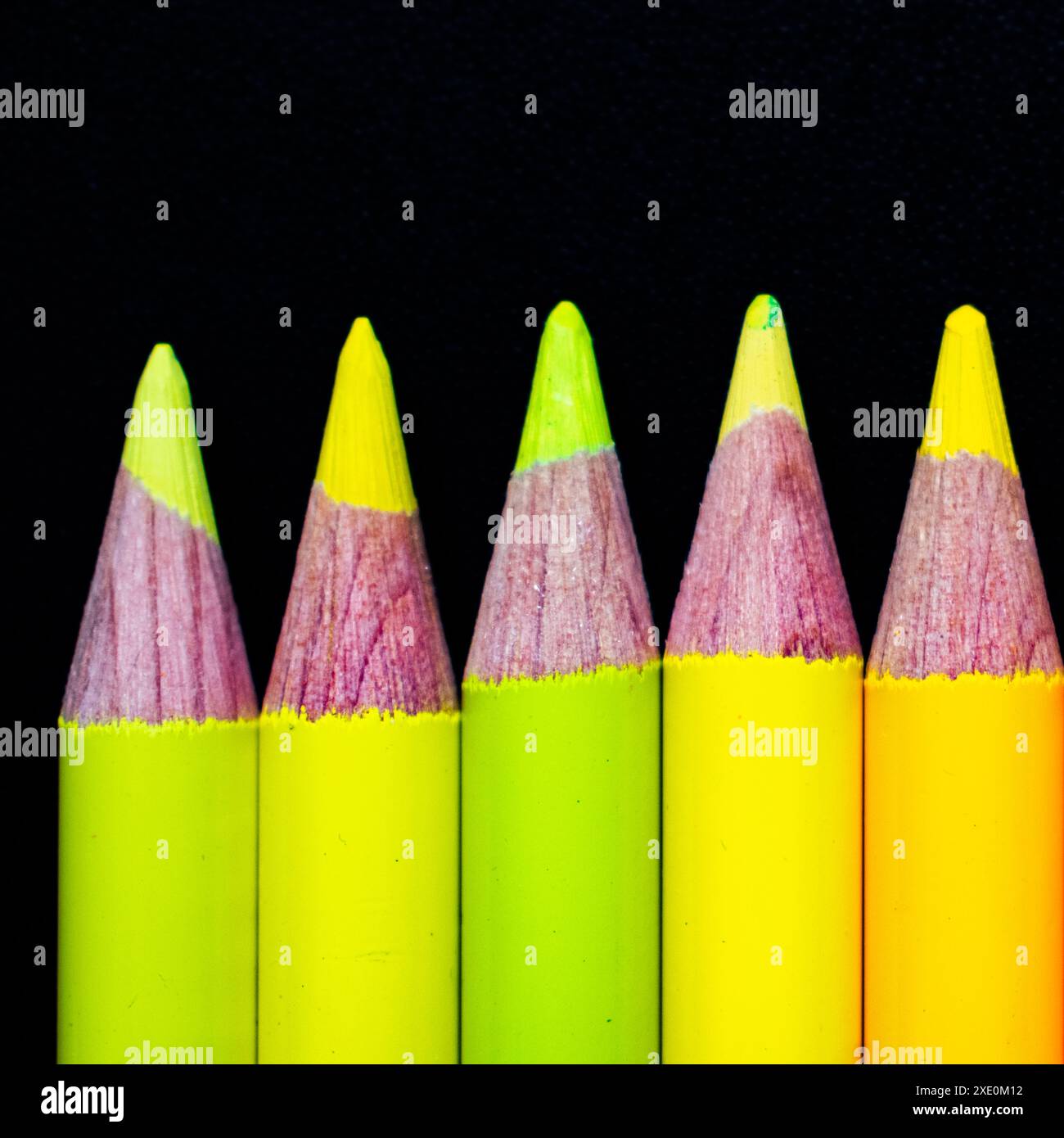 Yellow pencils on black ground Stock Photo