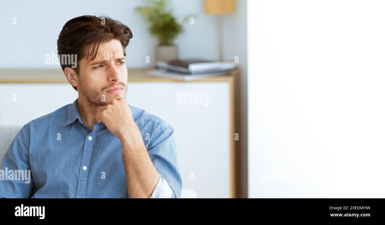 Man Thinking in a Room Stock Photo