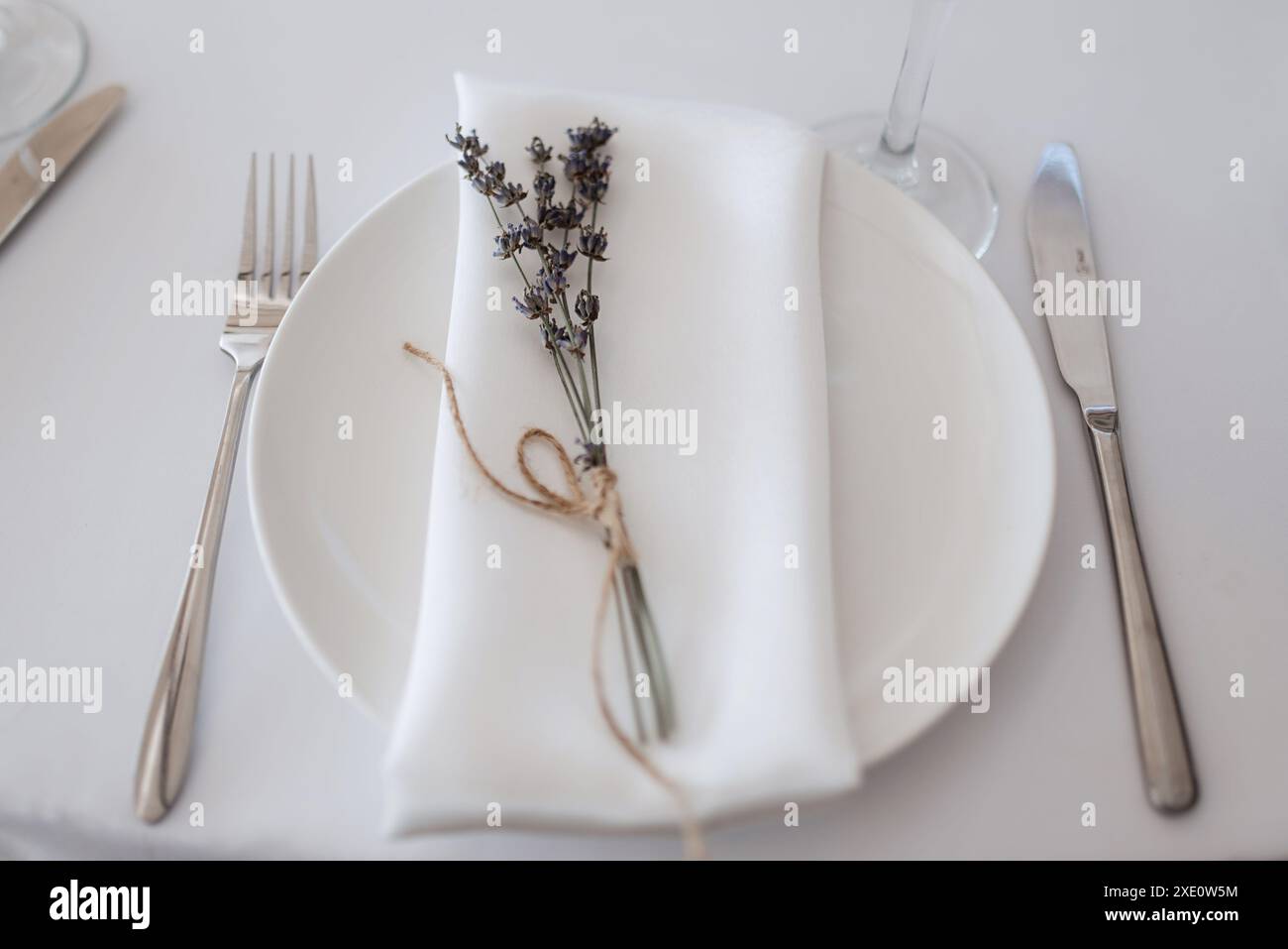 Elegant wedding plate decorations made of natural flowers Stock Photo