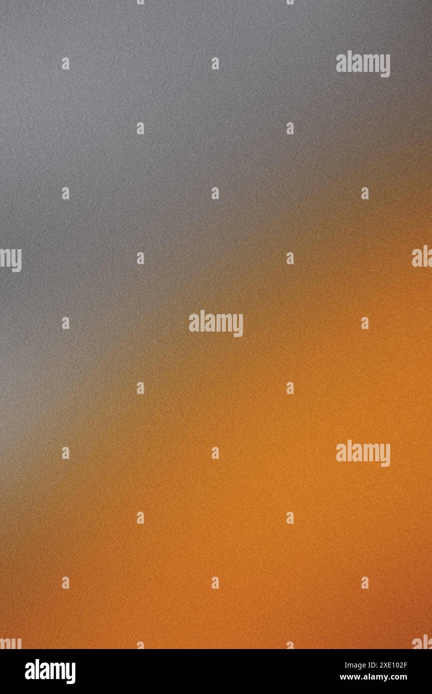 Gradient background fading from grey to orange with grainy texture Stock Photo